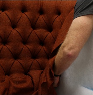 Tetrad deep buttoned upholstery being finished by hand